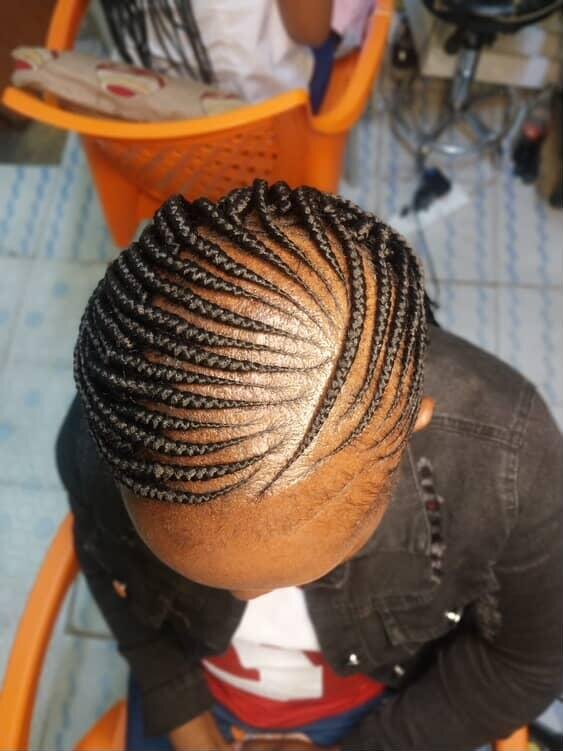 Sleek loc ponytail with curled tips