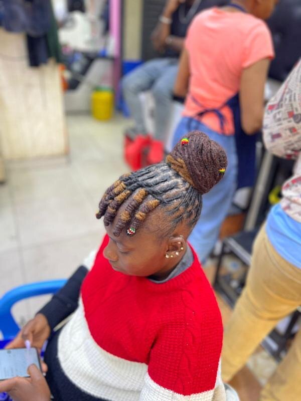 Loc bun with colourful bead accents