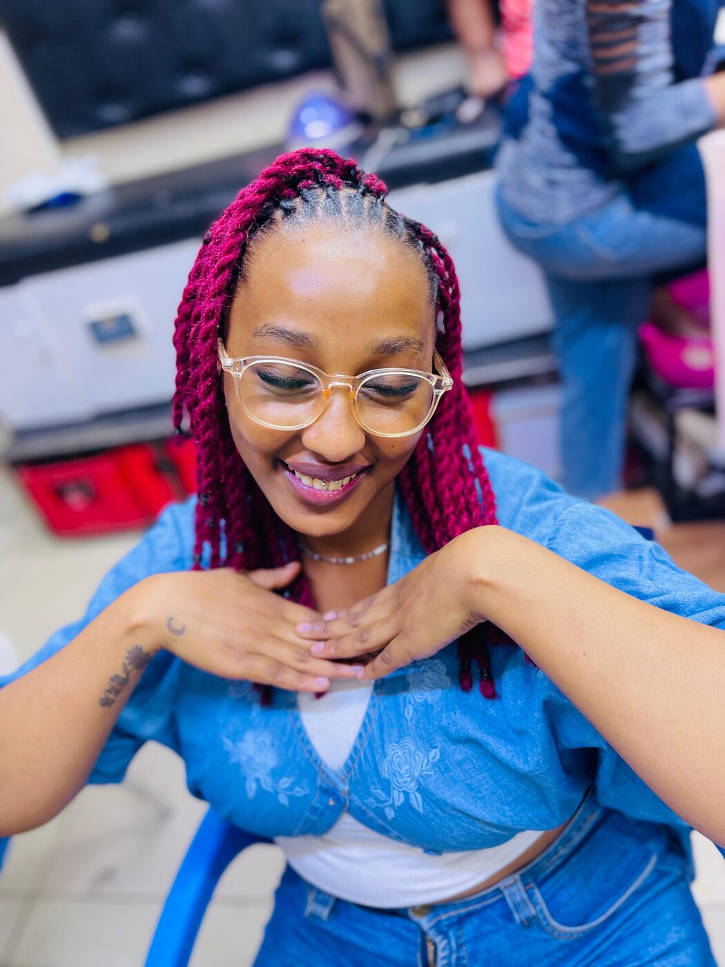 Midback length locs styled neatly